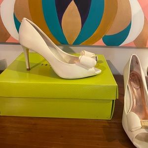 Ted Baker Alifair Heels. Peep toe w/Bow detail, gold T & bow brand insignia.